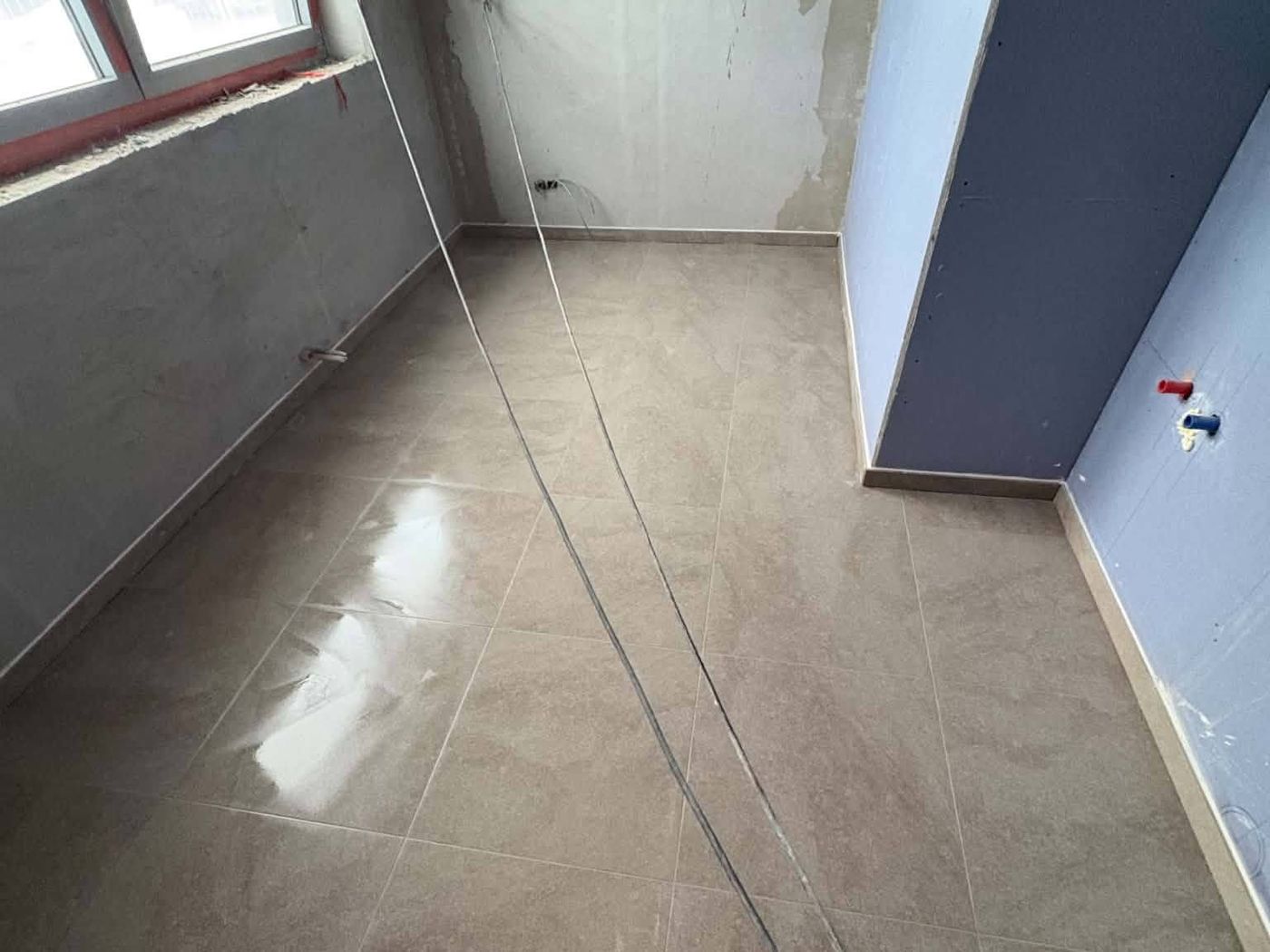 Chape et préparation du sol sur un chantier à Manage