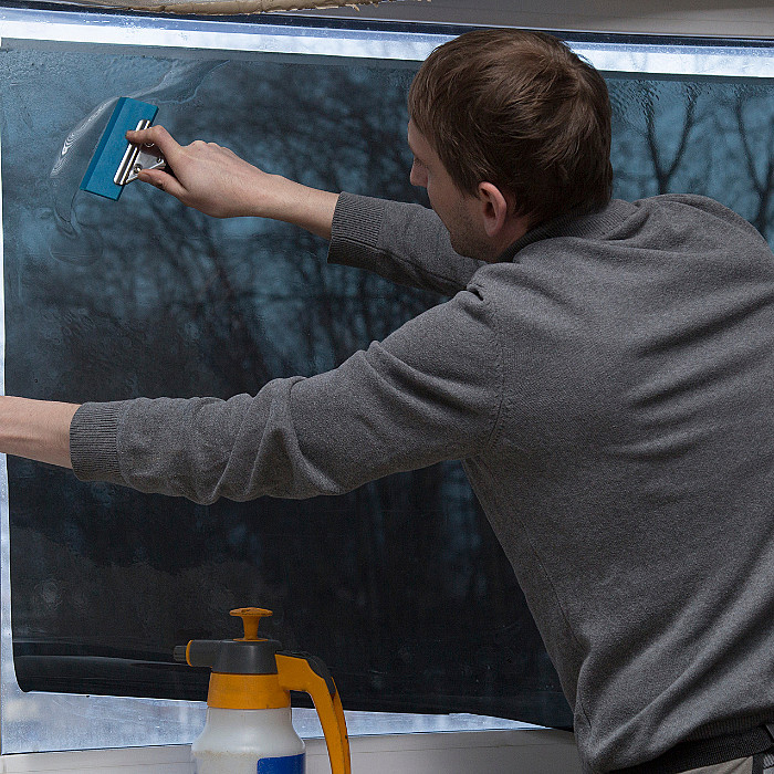 film solaire, application team, covering, atelier d'adhésif